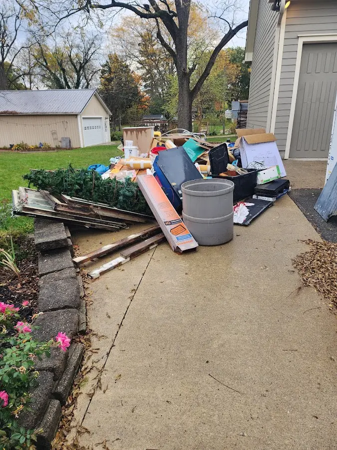 Dumpster being loaded with debris for Commercial Dumpster Rental in Bennington